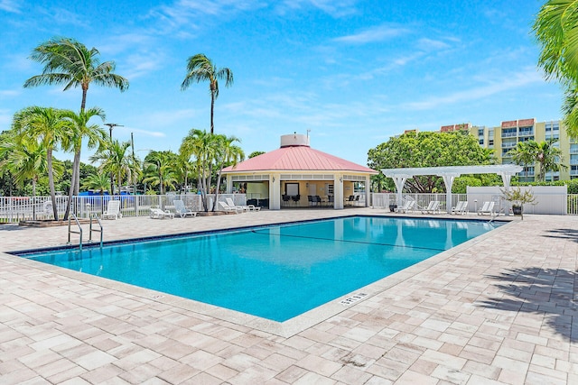 view of swimming pool featuring a patio, a gazebo, and a pergola