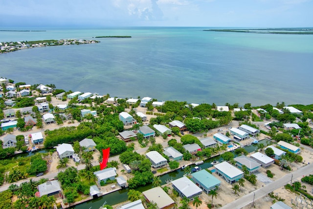 22841 Buccaneer Ln, Cudjoe, FL 33042 - aerial view of property and surrounding area with a large body of water and nearby suburban area