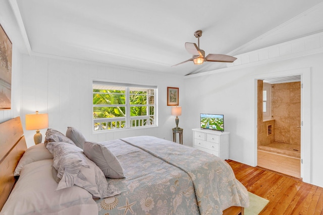 22841 Buccaneer Ln, Cudjoe, FL 33042 - bedroom featuring wood finished floors, vaulted ceiling, a ceiling fan, and ensuite bath