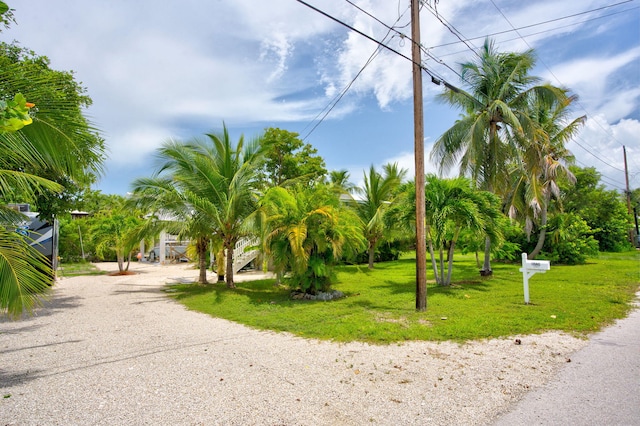 22841 Buccaneer Ln, Cudjoe, FL 33042 - view of home's community with a yard and gravel driveway