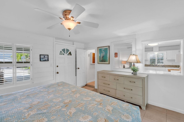 22841 Buccaneer Ln, Cudjoe, FL 33042 - bedroom with multiple windows, light tile patterned flooring, and ceiling fan