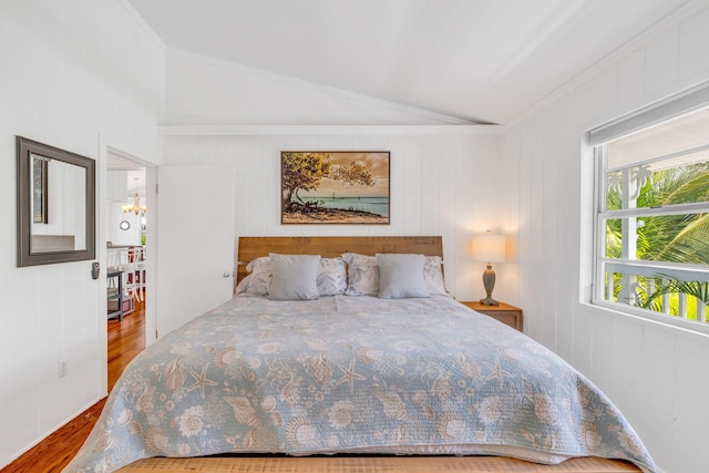 22841 Buccaneer Ln, Cudjoe, FL 33042 - bedroom with lofted ceiling, wood finished floors, and ornamental molding