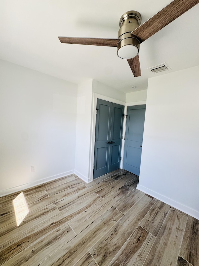 1708 Duncan St, Key West, FL 33040 - empty room with light wood-style floors and ceiling fan