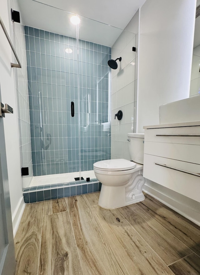 1708 Duncan St, Key West, FL 33040 - bathroom with a stall shower, wood finished floors, and vanity