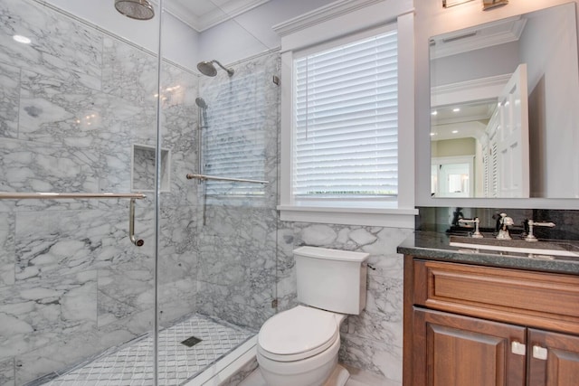 bathroom featuring toilet, crown molding, tile walls, vanity, and a shower with door