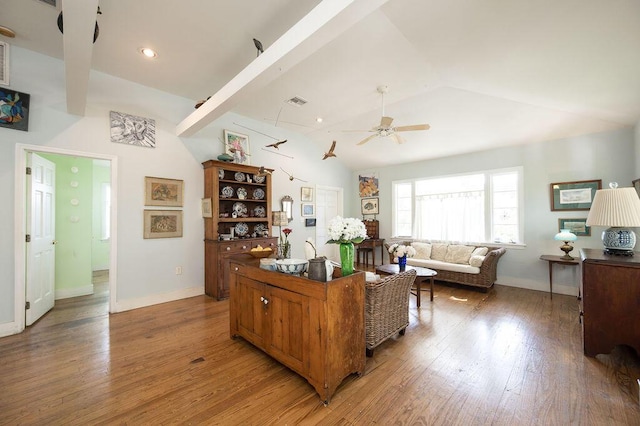 living room featuring lofted ceiling, light hardwood / wood-style flooring, and ceiling fan