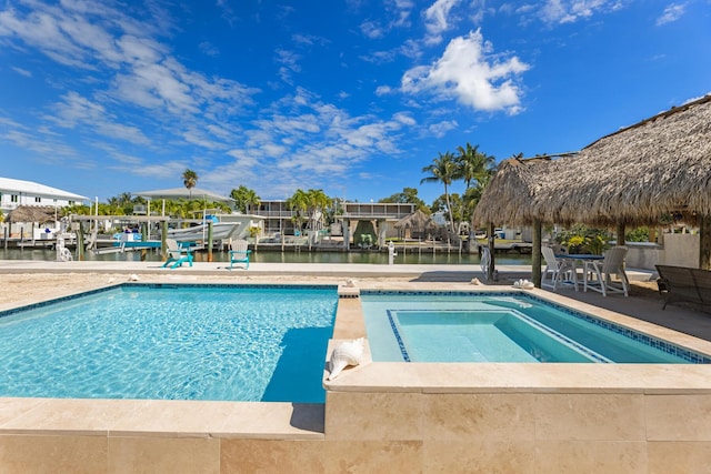 240 S Coconut Palm Blvd, Tavernier, FL 33070 - outdoor pool with an in-ground hot tub, a water view, and a patio