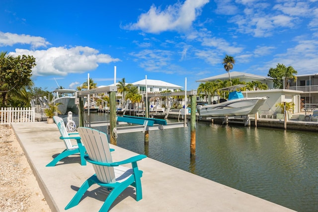 240 S Coconut Palm Blvd, Tavernier, FL 33070 - dock area featuring boat lift and a water view