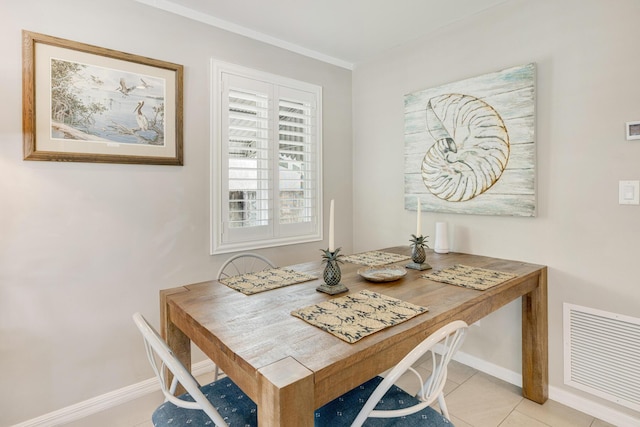 240 S Coconut Palm Blvd, Tavernier, FL 33070 - dining space with light tile patterned floors and crown molding