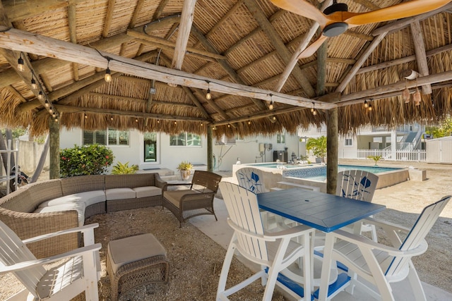 240 S Coconut Palm Blvd, Tavernier, FL 33070 - fenced backyard featuring a gazebo, ceiling fan, outdoor lounge area, and a patio area