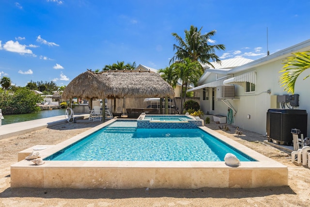 240 S Coconut Palm Blvd, Tavernier, FL 33070 - view of pool with a gazebo, a pool with connected hot tub, a water view, and a patio area
