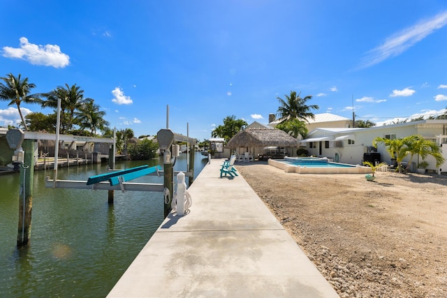 240 S Coconut Palm Blvd, Tavernier, FL 33070 - dock area with boat lift, an outdoor pool, a water view, and a gazebo
