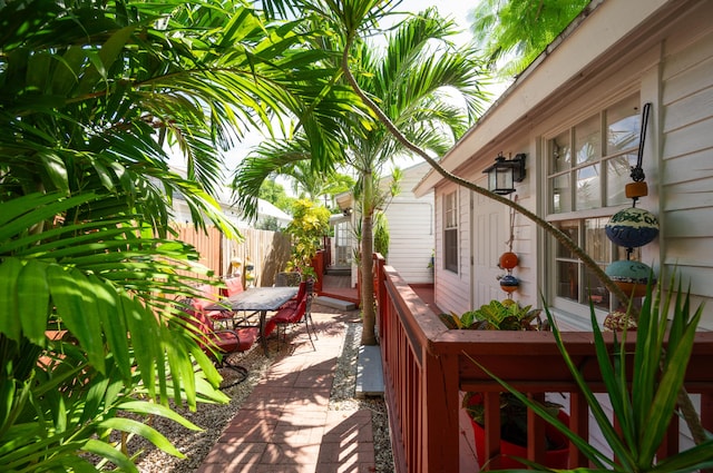 718 Chapman Ln, Key West, FL 33040 - wooden deck with a patio and outdoor dining area