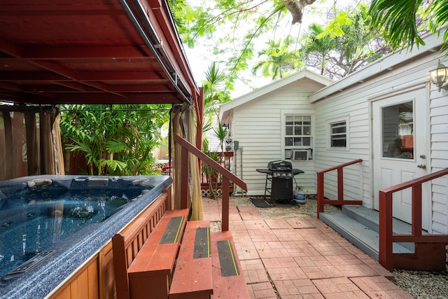 718 Chapman Ln, Key West, FL 33040 - view of patio with grilling area, a hot tub, and entry steps
