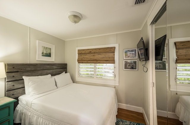 718 Chapman Ln, Key West, FL 33040 - bedroom with wood finished floors and ornamental molding