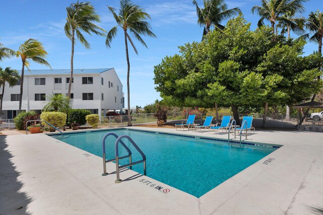 95 Coco Plum Dr Unit 2D, Marathon, FL 33050 - community pool with fence and a patio