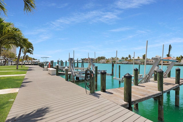 95 Coco Plum Dr Unit 2D, Marathon, FL 33050 - dock featuring boat lift and a water view