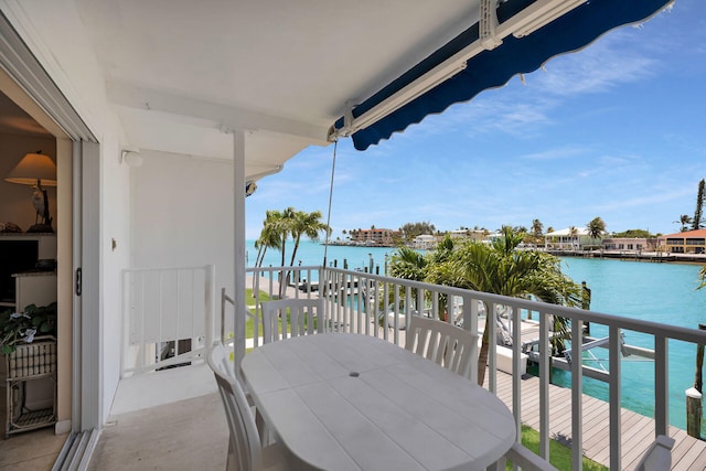 95 Coco Plum Dr Unit 2D, Marathon, FL 33050 - balcony featuring a water view and outdoor dining area