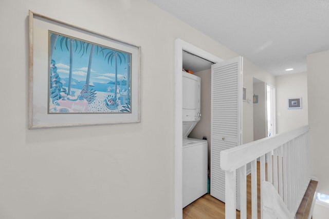 95 Coco Plum Dr Unit 2D, Marathon, FL 33050 - laundry room with stacked washer and clothes dryer and wood finished floors