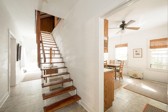 stairway with ceiling fan