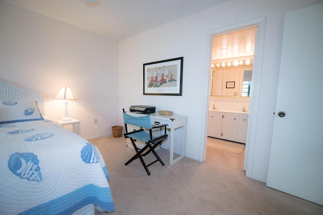 carpeted bedroom with connected bathroom