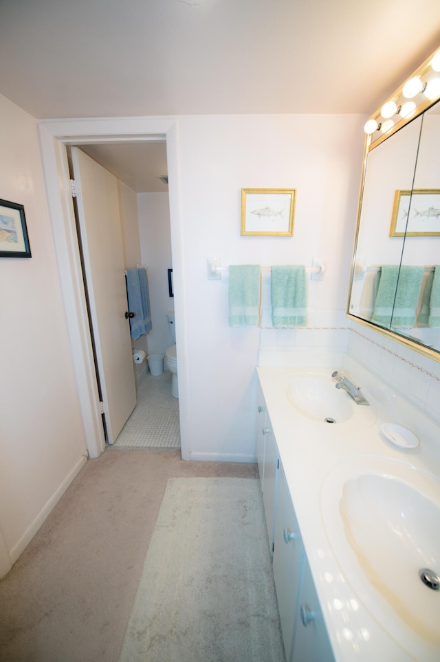 bathroom with vanity and toilet