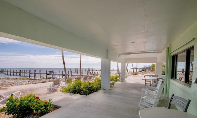 view of patio featuring a water view