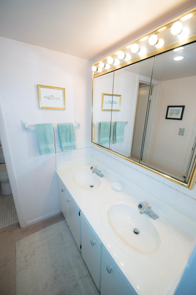 bathroom with vanity and toilet