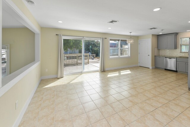 tiled empty room with ceiling fan