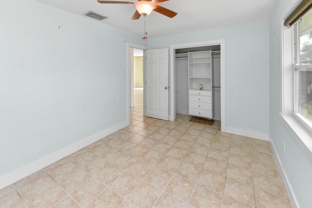 kitchen with tasteful backsplash, ceiling fan, appliances with stainless steel finishes, and gray cabinetry