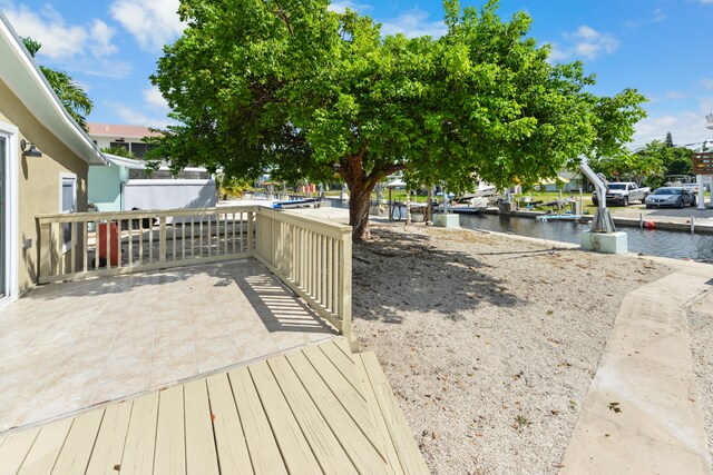 wooden terrace with a water view