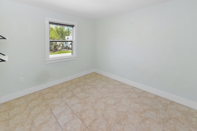 empty room featuring light tile patterned floors