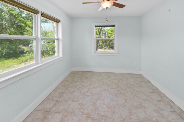 kitchen featuring sink, light tile patterned floors, backsplash, stainless steel appliances, and light stone counters