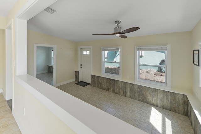 entrance foyer featuring ceiling fan and light tile patterned floors