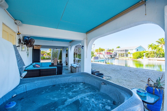 view of patio / terrace with a water view and an outdoor hangout area