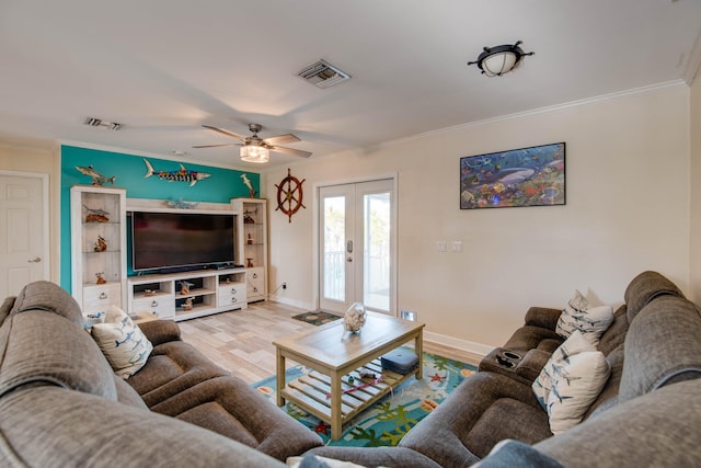 living room featuring french doors, ornamental molding, ceiling fan, and light hardwood / wood-style flooring