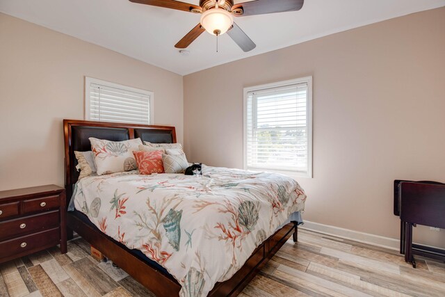 bedroom featuring light hardwood / wood-style floors and ceiling fan