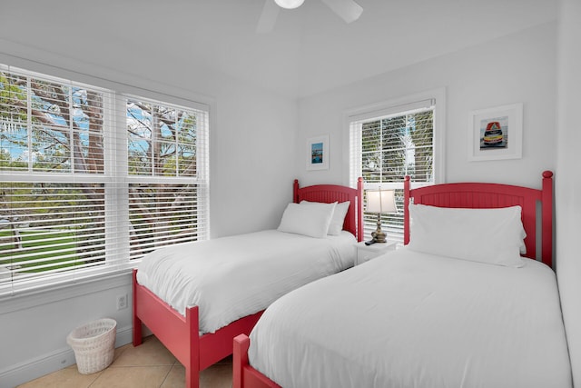 2600 Overseas Hwy Unit 25, Marathon, FL 33050 - bedroom featuring multiple windows, tile patterned flooring, ceiling fan, and baseboards