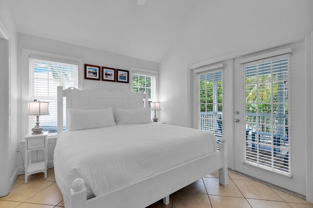2600 Overseas Hwy Unit 25, Marathon, FL 33050 - bedroom featuring access to outside, lofted ceiling, and light tile patterned floors