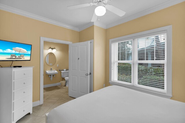 2600 Overseas Hwy Unit 25, Marathon, FL 33050 - bedroom with ornamental molding, light tile patterned floors, baseboards, ensuite bath, and ceiling fan
