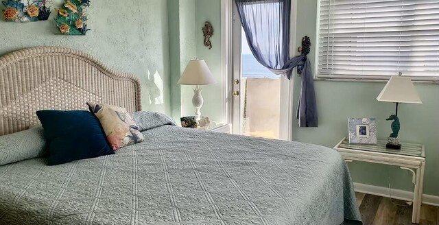 bedroom with hardwood / wood-style floors