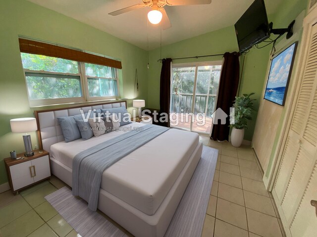 tiled bedroom featuring ceiling fan, access to exterior, and vaulted ceiling