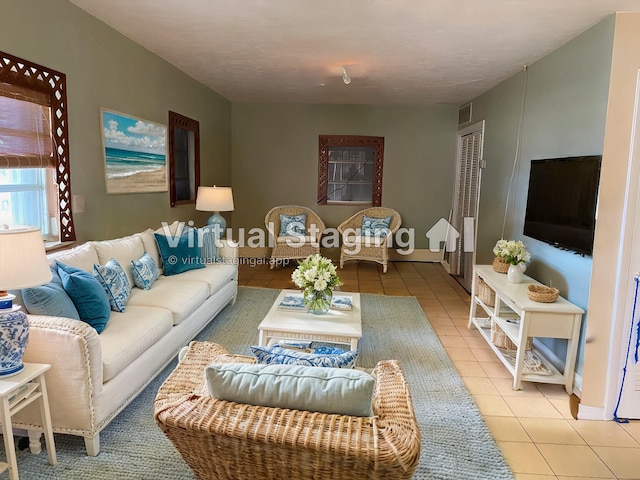 living room with light tile patterned floors