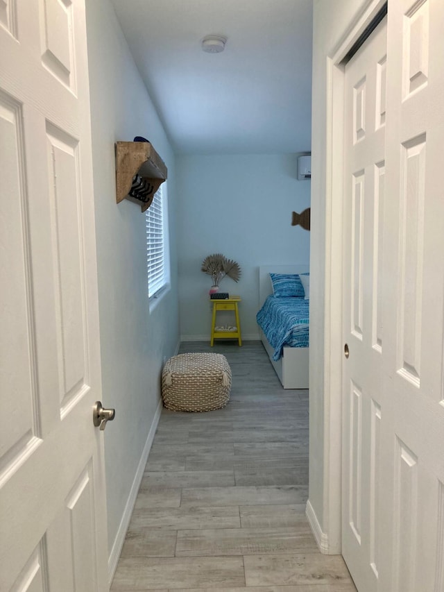 corridor with light hardwood / wood-style flooring