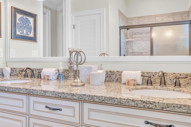 bathroom with walk in shower, vanity, and crown molding