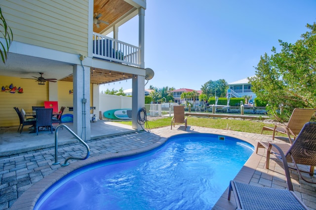 view of pool featuring ceiling fan and a patio area