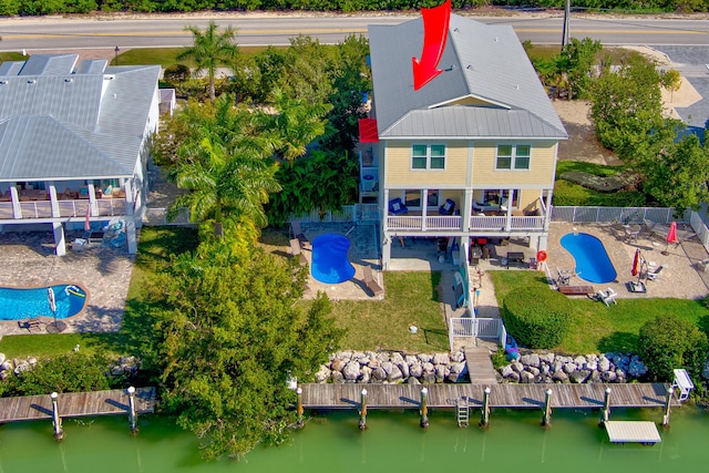 bird's eye view with a water view