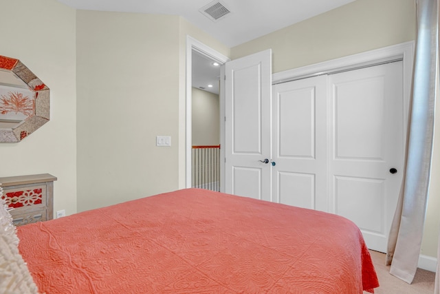 carpeted bedroom featuring a closet