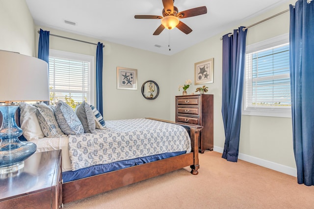 bedroom with light carpet and ceiling fan