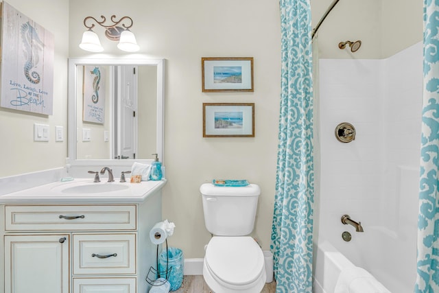 full bathroom featuring shower / bathtub combination with curtain, vanity, and toilet